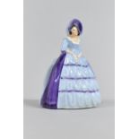 A Carlton Ware Napkin Ring in the Form of a Lady in Ruffled Blue Dress, 10cm high