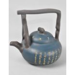 A Chinese Blue Ground Yixing Teapot with Calligraphy Decoration and Stylised Handle, Seal Mark to