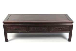 A Low Chinese Rectangular Padouk Wood Table with Three Drawers, 127cms by 51cms by 40cms High