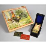 A Vintage Wooden Cube Animal Puzzle with Colour Picture Guides together with a De La Rue Bezique Set