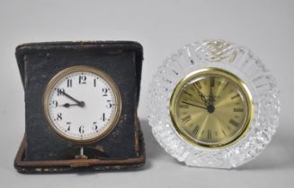 A Vintage Folding Travel Alarm Clock together with a Circular Tyrone Lead Crystal Mantel Clock