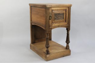 A Vintage French Bedside Cupboard with Carved Panel to Door, Reeded Supports and Plinth Base,
