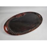 A Chinese Lacquered Oval Two Handled Tray, Border Designed as a Dragon, 68cms Long