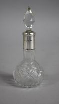 A Glass and Silver Mounted Dressing Table Scent Bottle, London Hallmark 1923, 16cm high