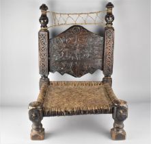 A Late 19th Century North African or Moroccan Hand Carved Hardwood Low Chair with Hide Stringing and