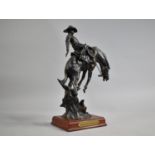 A Western Moments Resin Figure of Cowboy Breaking Horse, "Breakin' Out The Bad Ones", 33cms High