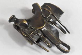 A Novelty Patinated Bronze Door Knocker in the Form of an American Saddle, 13cms Wide