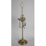 An Indian Brass Temple Three Three Branch Oil Lamp with Tools Attached to Chains, 39cms High