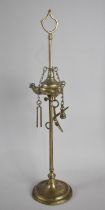 An Indian Brass Temple Three Three Branch Oil Lamp with Tools Attached to Chains, 39cms High