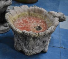 A Reconstituted Stone Garden Birdbath of Tree Trunk Form, 34cm Diameter and 27cms High