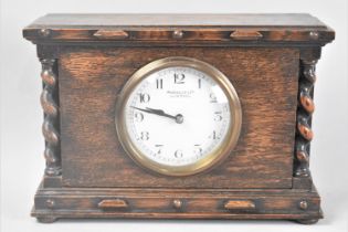 An Edwardian Oak Mantel Clock with Barley Twist Pilasters, 23.5cms Wide