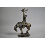 An American Resin Study of Mounted Indian Holding Stag Skull Aloft, 26cms High