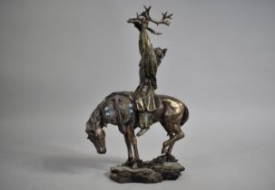 An American Resin Study of Mounted Indian Holding Stag Skull Aloft, 26cms High