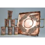 An Art Nouveau Pressed Copper Two Handled Tray together with Six Beakers, Tray 30cms Square