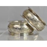 A Pair of Silver Napkin Rings with Floral Decoration by J&C, Birmingham 1911