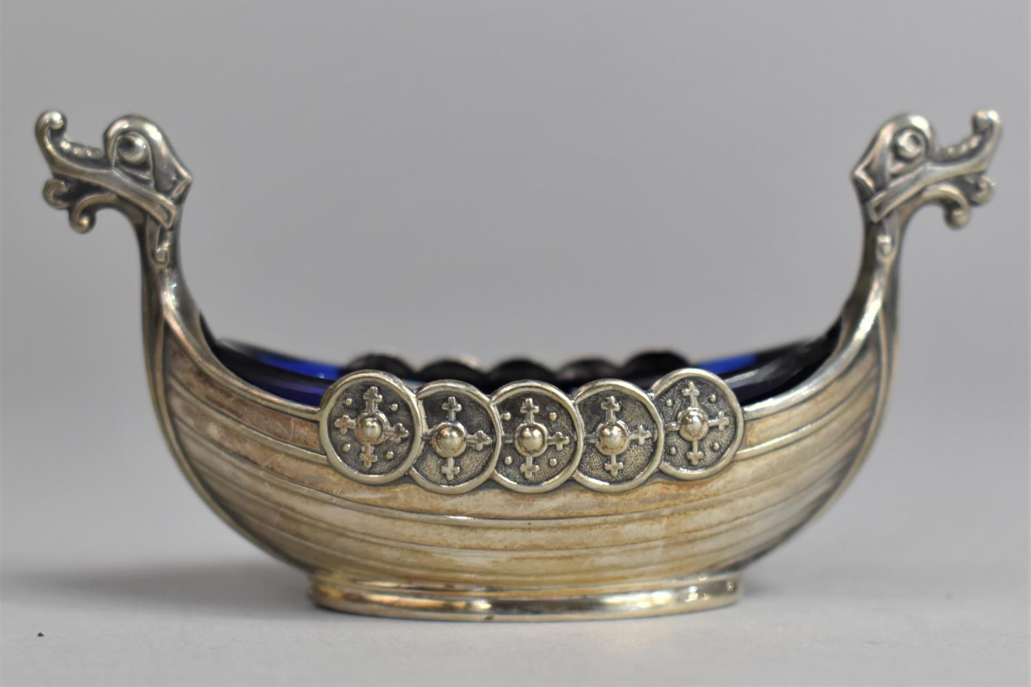 A Sterling Silver Salt in the Form of Viking Boat, Complete with Blue Glass Liner, Stamped 925 S.