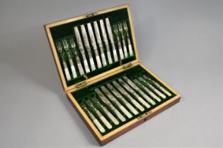 An Early 20th Century Cased Canteen of Twelve Silver Plated Fruit Knives and Forks with Mother Pearl