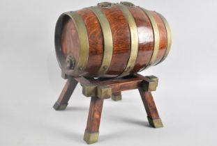 An Edwardian Oak Double Ended Coopered Spirit Barrel on Stand, 24cms Long