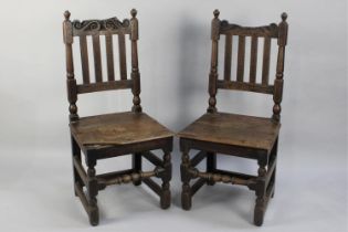 A Pair of Late 19th Century Gothic Revival Oak Hall Side Chairs with Carved Top Rails and Back Slats