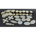 A Collection of 19th Century Mother of Pearl Ended Cotton Reels Together with Various Games Counters