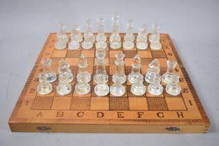 A Mid 20th century Folding Chess and Backgammon Board complete with Glass Chess Pieces, Kings 8cms