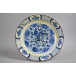 A 17th/18th Century Delft Blue and White Plate Decorated with Mythical Beast Among Foliage and