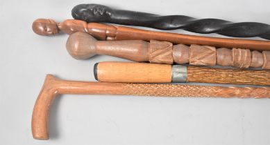 A Collection of Five Carved African Walking Sticks