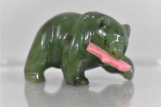 A Carved Jade Bear with a Pink Rhodonite Salmon in it's Mouth, 4cm wide