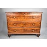 A 19th Century Flame Mahogany Chest of Three Drawers on Bun Feet, Having Soft Wood Knobs with Mother