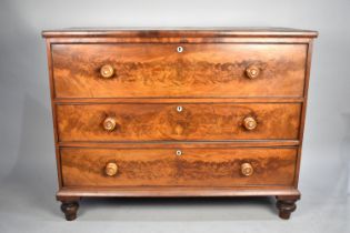 A 19th Century Flame Mahogany Chest of Three Drawers on Bun Feet, Having Soft Wood Knobs with Mother