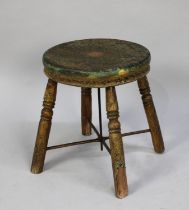 A Vintage Circular Topped Stool with Metal Brace and Stretcher on Four Turned Supports, 30cms
