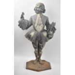 A Heavy Cast Iron Fireside Companion Stand in the Form of a Dandy with Hand Mirror, 57cms High