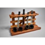 A Mid/Late 20th Century Novelty Pipe Rack in the Form of a Three Bar Gate Containing Four Vintage