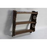 An Edwardian Wall Hanging Three Shelf Unit with Pierced Sides, 62cms Wide