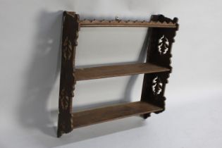 An Edwardian Wall Hanging Three Shelf Unit with Pierced Sides, 62cms Wide