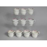 A Set of Seven Plus Three Early 19th Century Porcelain Cups Decorated with Pink Floral Swag Design