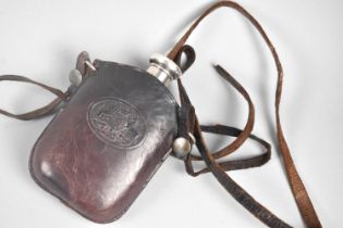 A Glass Hip Flask with Silver Screw off Lid in Tooled Leather Pouch having Embossed Royal Crest