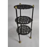 A Cast Metal Black Painted Three Tier Pan Stand, 52cms High