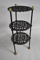 A Cast Metal Black Painted Three Tier Pan Stand, 52cms High