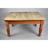 A 19th Century Pine Four Plank Scrub Top Scullery Table with Canted Edges on Turned Painted Reeded