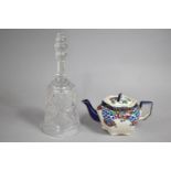 A Cut Glass Bell and a 'Dresden' Ellgreave Pottery Teapot