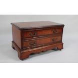 A Mahogany TV/DVD Stand with Pull Down Front in the Form of Two Long Drawers, 73cms Wide