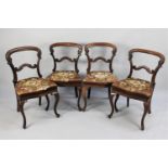 A Set of Four Victorian Mahogany Balloon Back Dining Chairs with Upholstered Floral Patterned Seats