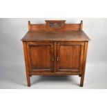 An Early 20th Oak Washstand with a Carved Gallery Back, Panelled Cupboard Base on Square Supports,