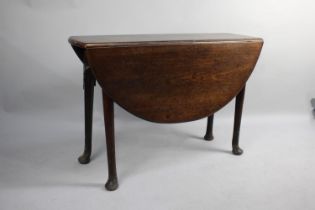 An 19th Century Oak Drop Leaf Table with Pad Feet, 104cm wide, with Repair etc