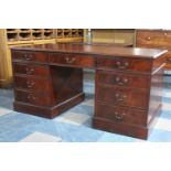 A Reproduction Mahogany Kneehole Desk with Red Leather Effect Top, Pull Down Keyboard Centre and Two