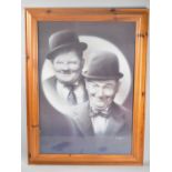 A Framed Print, Laurel and Hardy, 48x69cm