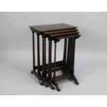 A Mid 20th Century Mahogany Nest of Three Rectangular Tables with Spindle Supports, 47cms Wide