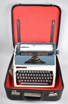 A Vintage Erika Manual Portable Typewriter with Instruction Booklet