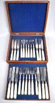 An Edwardian Mahogany Cased Canteen of Twelve Mother of Pearl Handled Fruit Knives and Forks